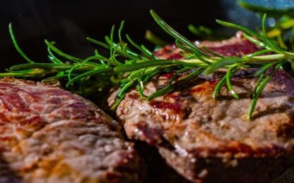 Seared flat iron steaks with fresh rosemary.